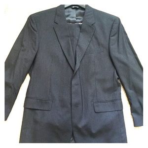 Navy blue pinstriped men’s suit jacket and pants